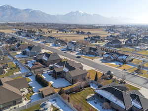 Aerial perspective of suburban area featuring a mountainous background
