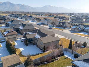 Aerial view of residential area featuring a mountainous background