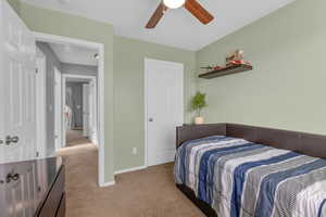 Bedroom featuring carpet and ceiling fan