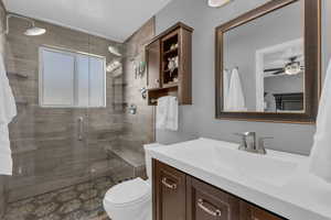 Primary bathroom with vanity and a double shower head shower