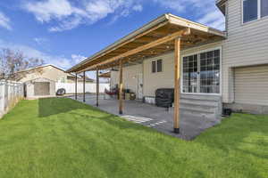 Back of house with a storage shed, a patio area, a fenced backyard, and entry steps