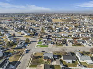 Aerial view of property's location featuring nearby suburban area