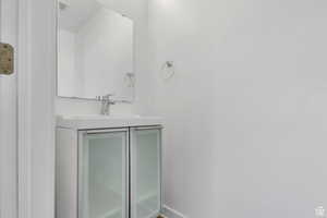 Bathroom with vanity and baseboards