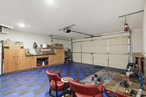 Garage with a heating unit and a garage door opener