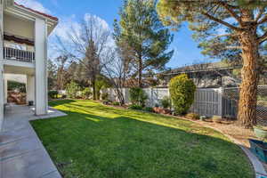 Fenced backyard with a patio area