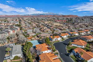 Aerial view of residential area featuring a mountainous background