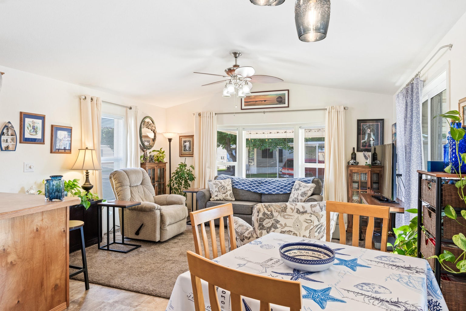 Dining room featuring lofted ceiling and ceiling fan