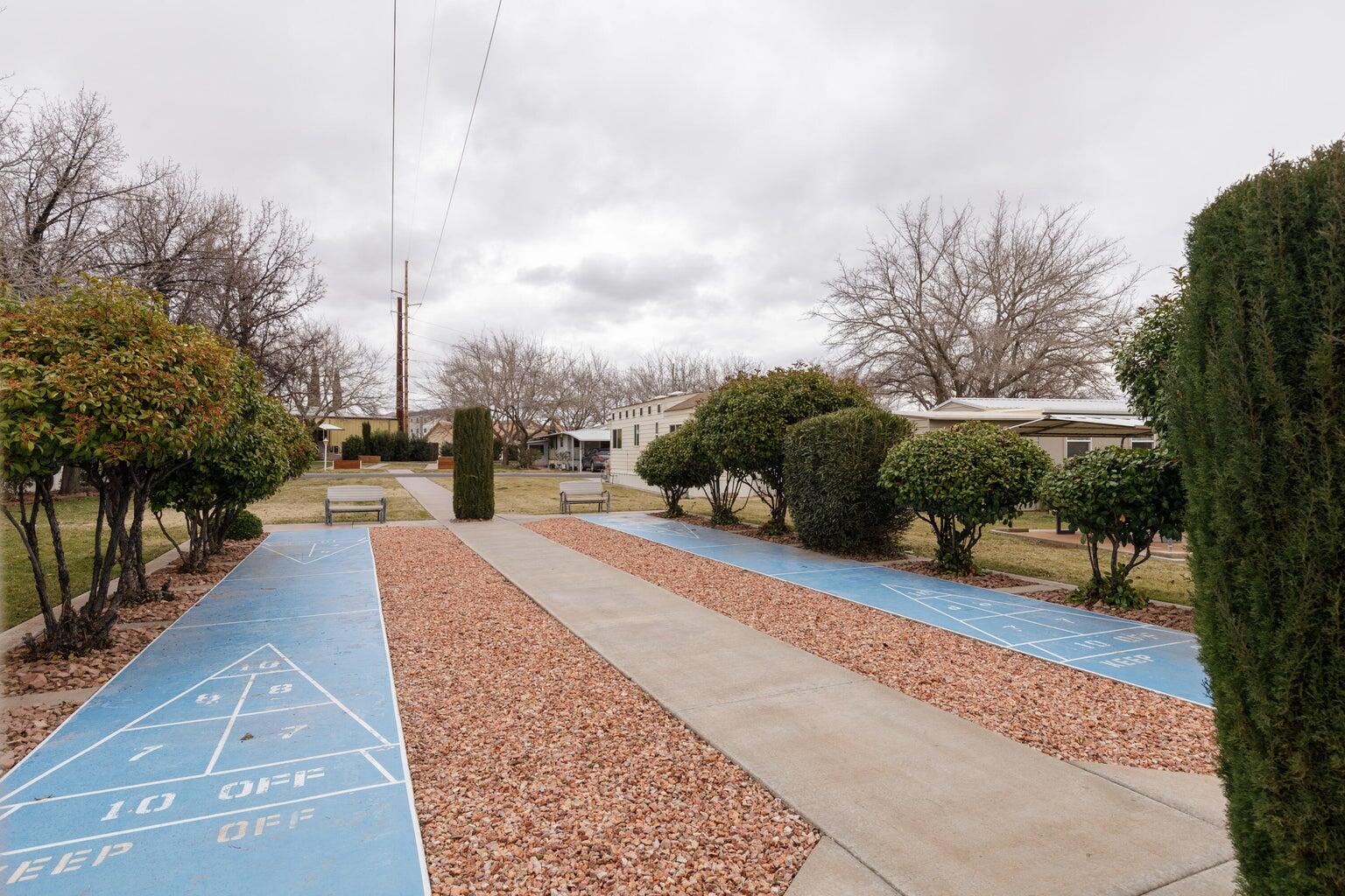 View of property's community with shuffleboard