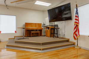 Living room featuring a drop ceiling and light wood finished floors
