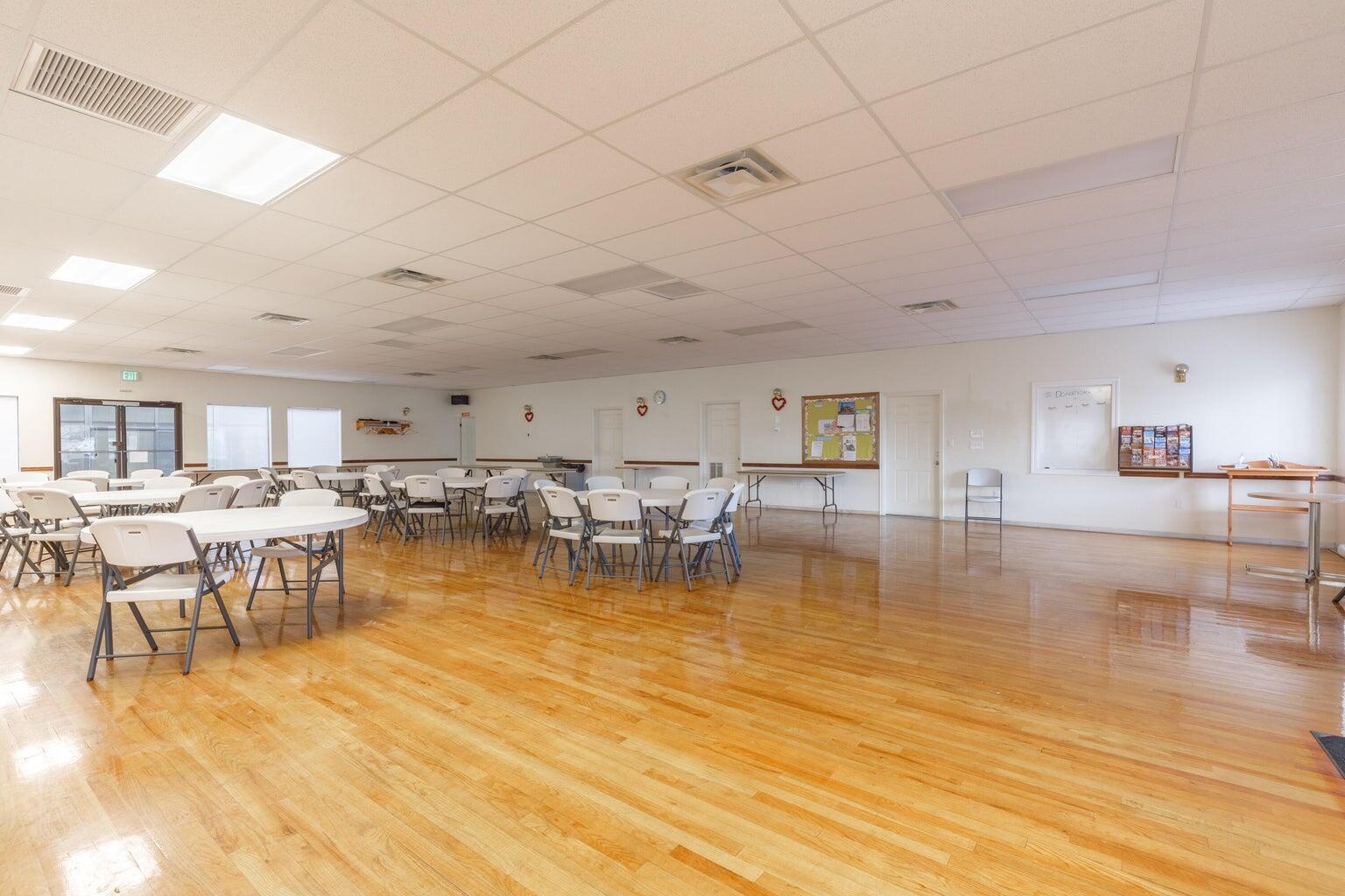 Dining space featuring a drop ceiling and light wood-type flooring