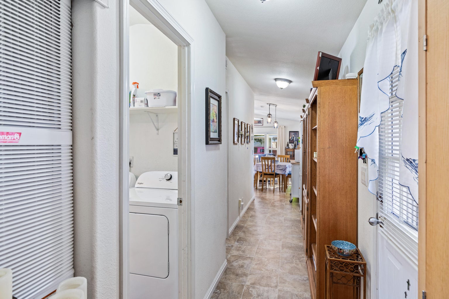 Hall featuring a heating unit and washer / dryer