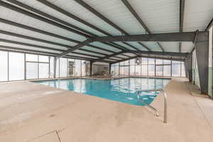 Indoor community pool with a sunroom