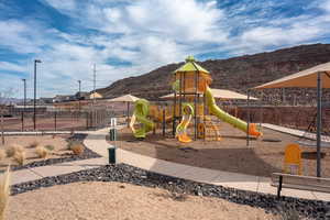 Communal playground featuring a mountain view