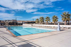 Community pool featuring a patio area