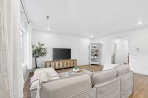 Living room featuring recessed lighting and wood finished floors