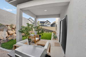 Fenced backyard featuring a patio area, area for grilling, and outdoor lounge area