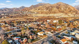 Aerial perspective of suburban area featuring a mountain backdrop
