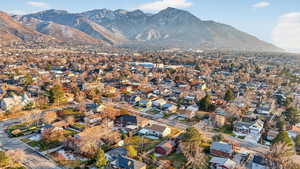 View of property location featuring nearby suburban area and a mountainous background