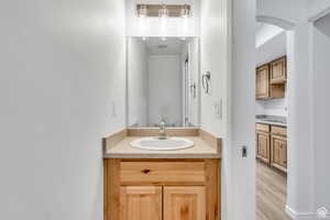 Bathroom featuring vanity and light wood-type flooring