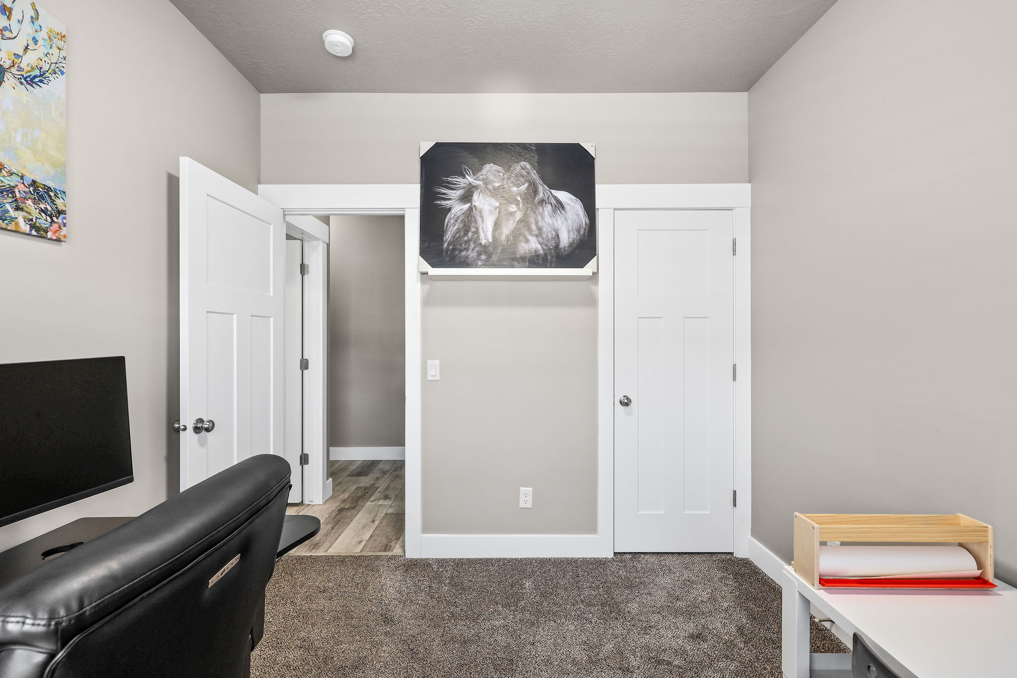 Office with carpet floors and baseboards