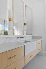 Bathroom with vanity and tile patterned flooring