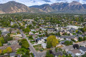 Aerial view of residential area featuring a mountain backdrop