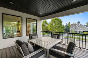 Wooden deck featuring outdoor dining space
