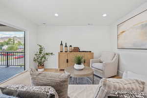 Living room featuring wood finished floors, recessed lighting, and a mountain view