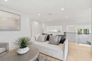 Living room featuring recessed lighting and light wood finished floors