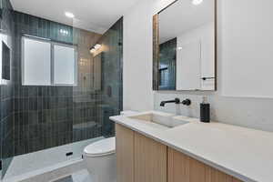 Bathroom with vanity and a walk in shower