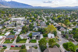Aerial perspective of suburban area featuring a mountain backdrop