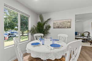 Dining area with wood finished floors