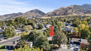 View of mountain backdrop featuring nearby suburban area