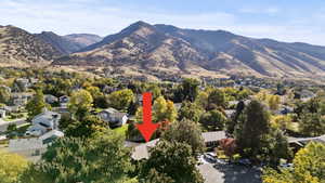 View of mountain backdrop featuring nearby suburban area