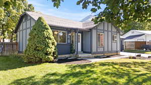 Tudor house featuring a shingled roof