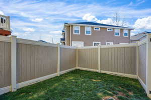 View of fenced backyard