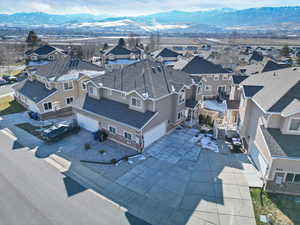 Aerial view of residential area featuring a mountain backdrop
