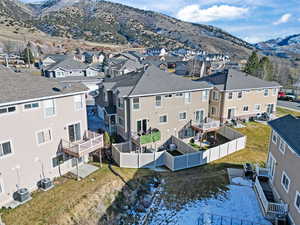 Aerial view of residential area featuring mountains