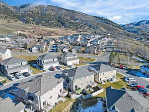 Aerial view of residential area featuring a mountain backdrop