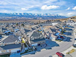 Aerial perspective of suburban area with a mountainous background