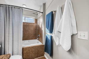 Bathroom with shower / bath combo and toilet