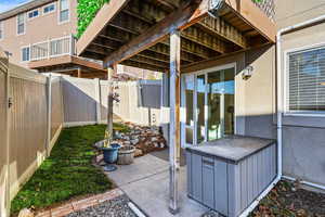 Fenced backyard featuring a patio area