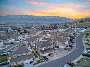 Aerial view at dusk of a residential view and a mountain view