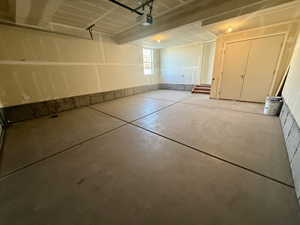 Garage featuring a garage door opener