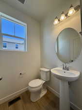Bathroom featuring wood finished floors