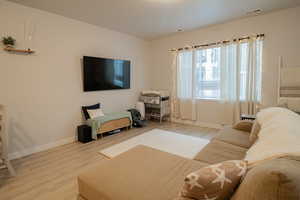 Living room with wood finished floors and baseboards