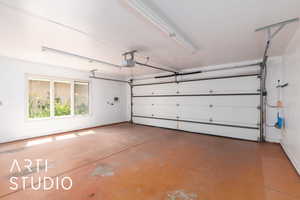 Garage featuring a garage door opener