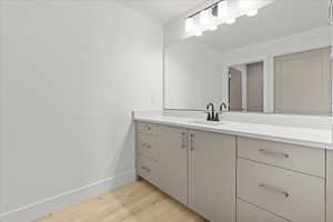 Bathroom featuring vanity and light wood-type flooring