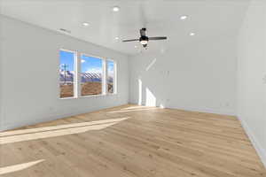 Spare room featuring light wood-style flooring, recessed lighting, and ceiling fan