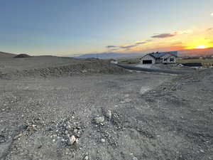 View of dirt / gravel road featuring a mountain view
